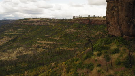 butte creek california, canyon reveal behind rocky clifftop, aerial view