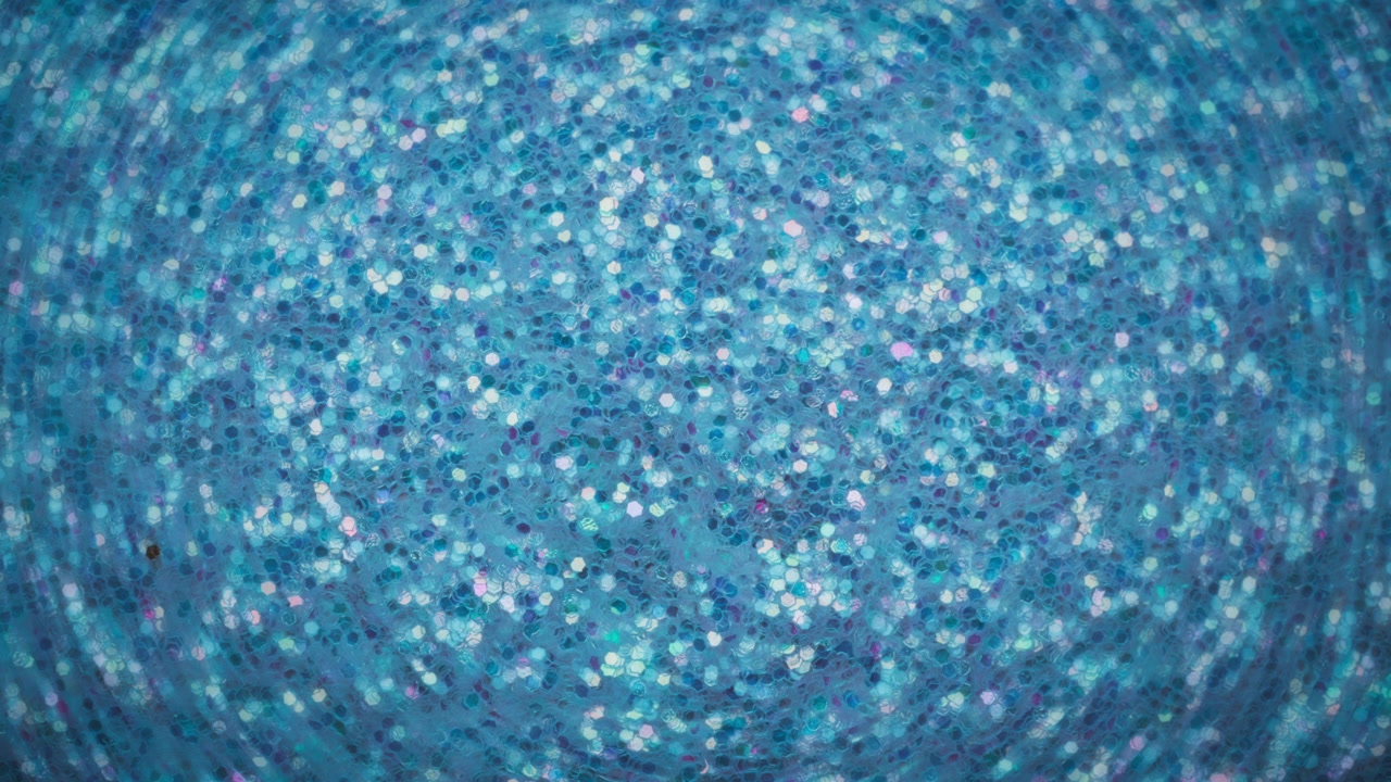 Abstract background of glowing light blue glitter