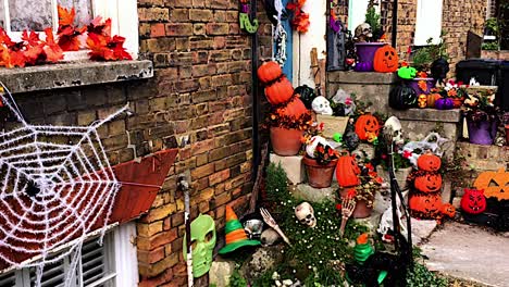 Doorstep-decorated-for-Halloween-with-pumpkins-and-skulls