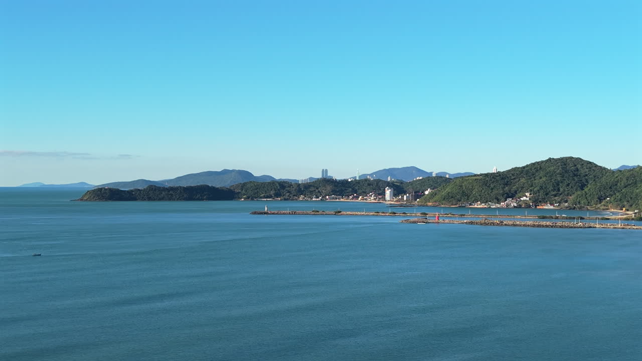 Drone view of the Navegantes Lighthouse and Molhe de Itajaí on the Santa Catarina coast, Brazil