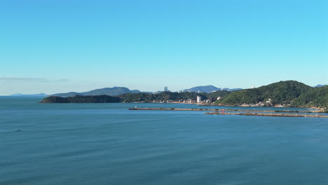 drone view of the navegantes lighthouse and molhe de itajaí on the santa catarina coast, brazil