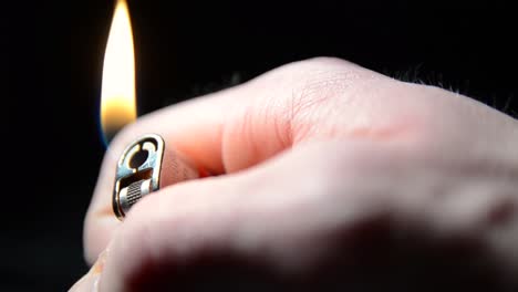 man hand lighting a lighter close up