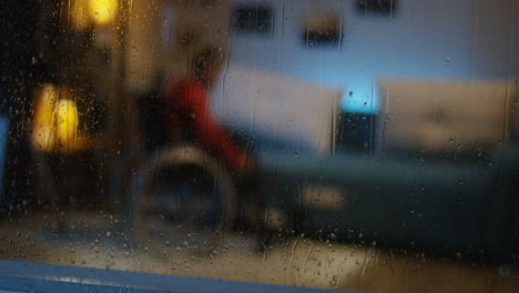 child in wheelchair using smartphone