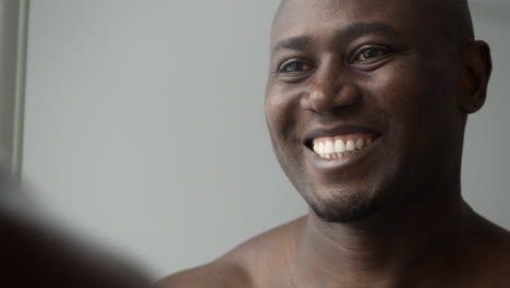 happy man looking in a mirror