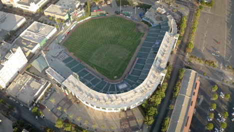 aerial view of an empty baseball stadium in a city