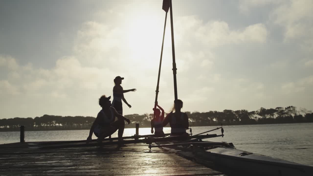 Female rowing team training on a river