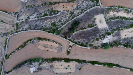 magnificent aerial drone video from malta, ghar-id-duhhan southern area, flying from to land above the sea through the wavy coast