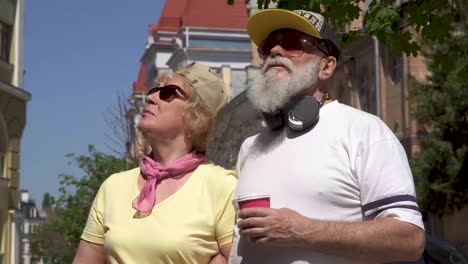 fashionable senior couple walking in the city and enjoy each other