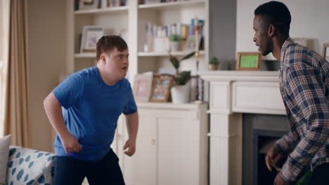 happy-father-dancing-with-teenage-son-funny-teenager-boy-with-down-syndrome-having-fun-enjoying-playful-dance-with-dad-enjoying-weekend-crazy-family-home-4k-footage