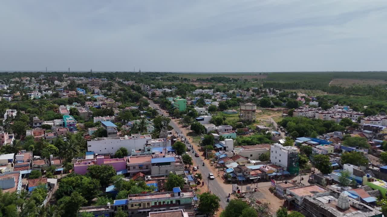 Bird's-eye view of Pudukkottai city streets bustling with activity.