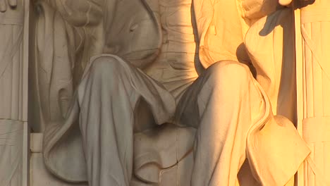 close up of a statue of president lincoln bathed in golden light