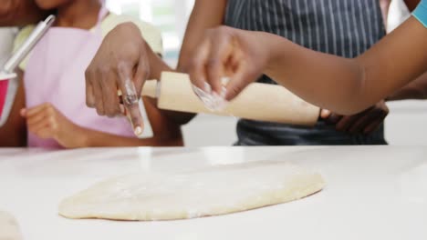 happy family preparing food in kitchen