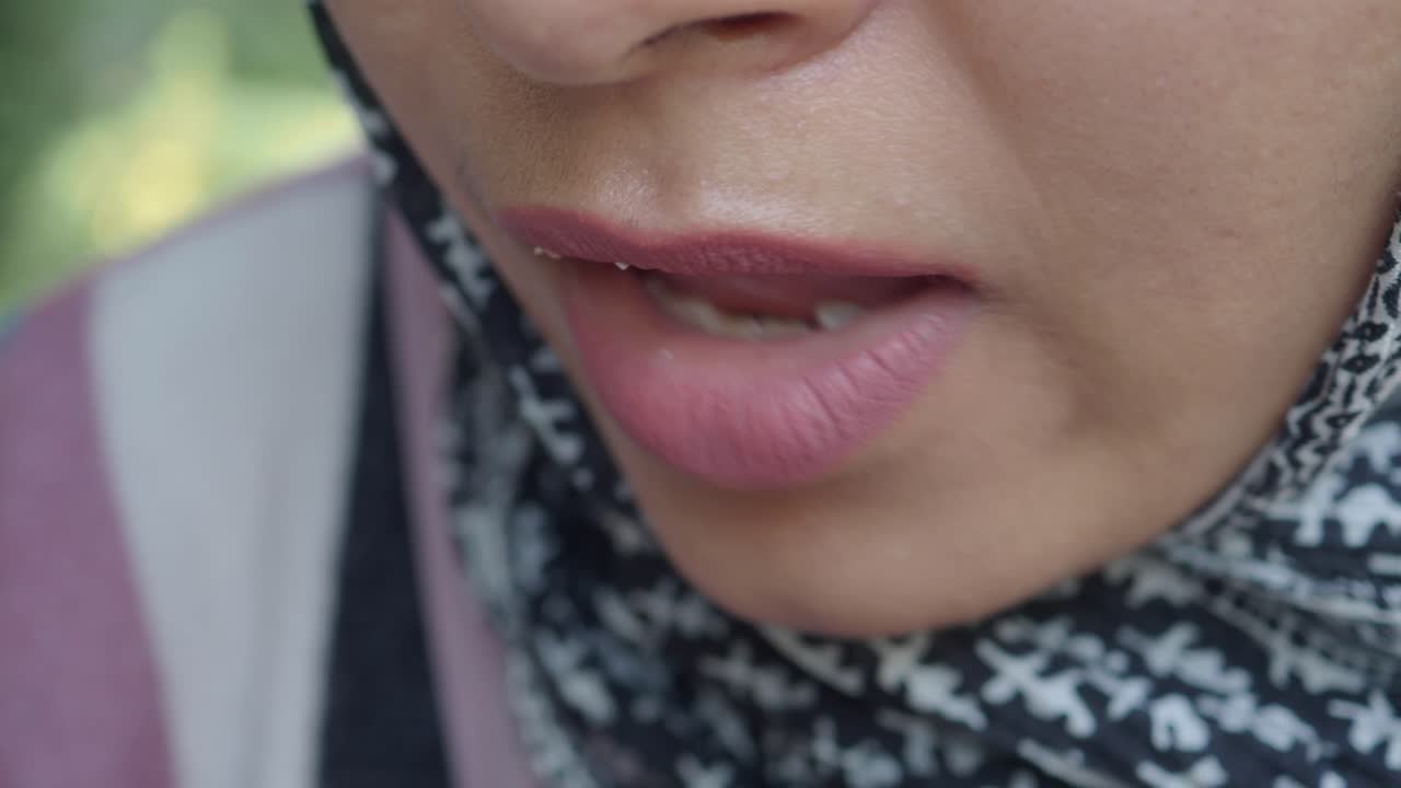 Woman eating with spoon