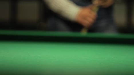 marker puts balls on the pool table