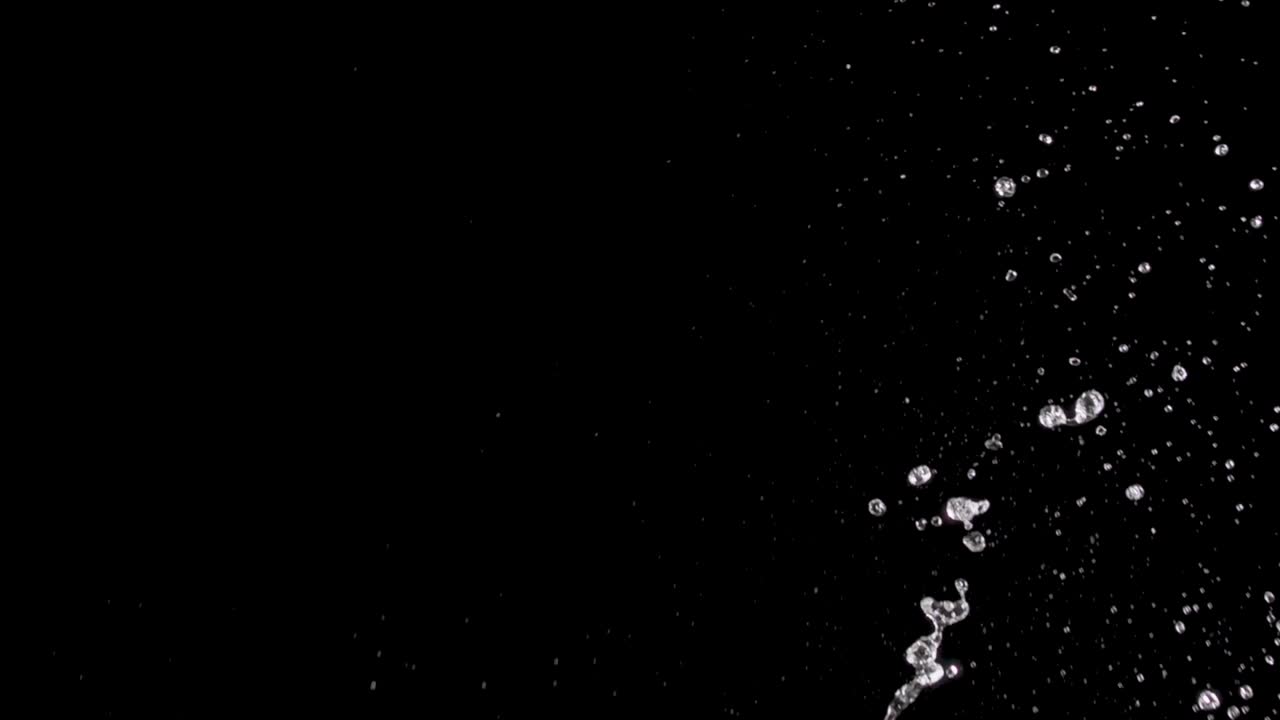 Splattering Water on a Black Background