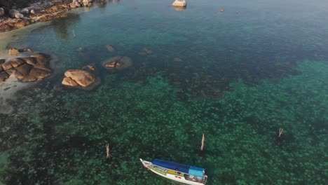 Wide-view-of-Tanjung-Tinggi-Beach-with-big-boulders-at-Belitung,-aerial