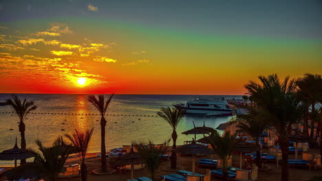 timelapse of colorful sunset in the ocean seen from a luxury resort