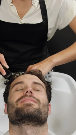 man getting his hair wash