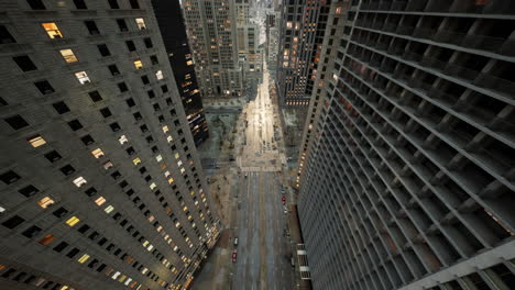 Aerial-hyperlapse-of-busy-car-traffic-in-between-Skyscrapers-city-center