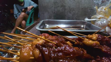 assorted filipino street food skewers on display