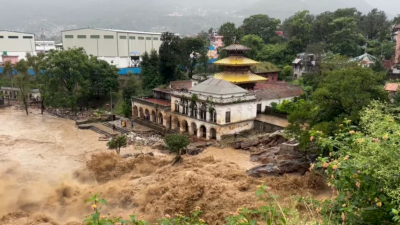 The flooding of the Bagmati River damaged the road and riverbank during heavy rainfall in Kathmandu, Nepal.