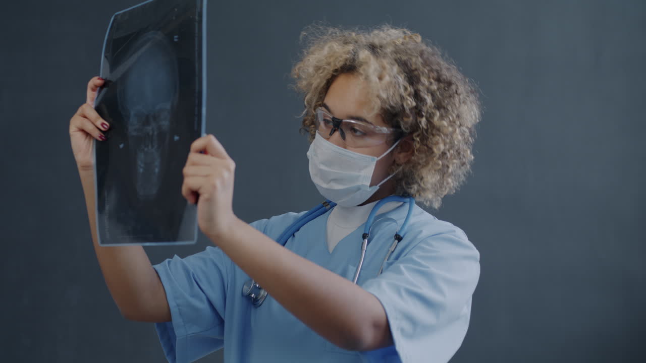 Doctor Examining Skull X-Ray