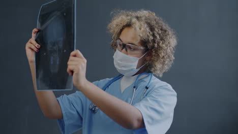 doctor examining skull x-ray