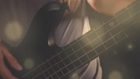 male musician playing bass guitar in music education with animated waves showing fret positions