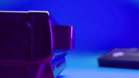 close up view of video vhs device on blue background