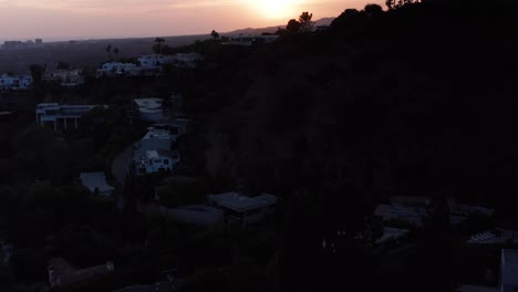 aerial tilting up shot of beverly hills during sunset