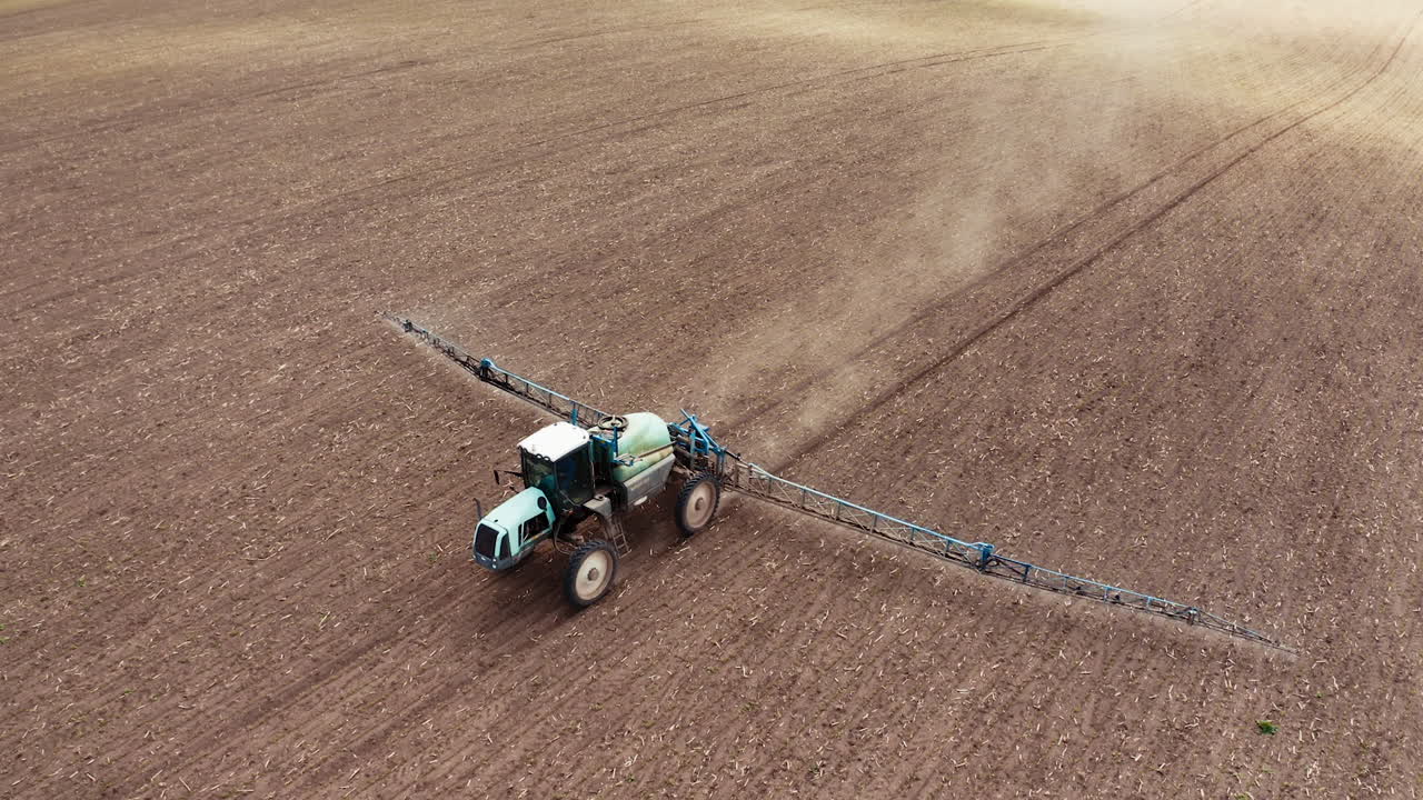 Farm machine sprayer tractor. Aerial view of modern farm machine sprayer on field