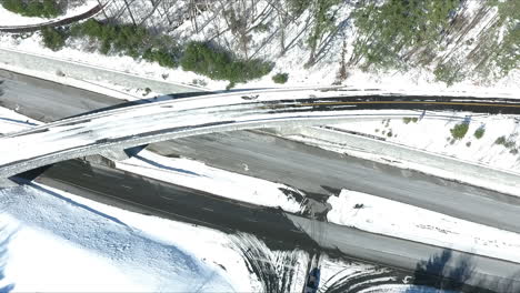 drone shot of snow-covered road or highway