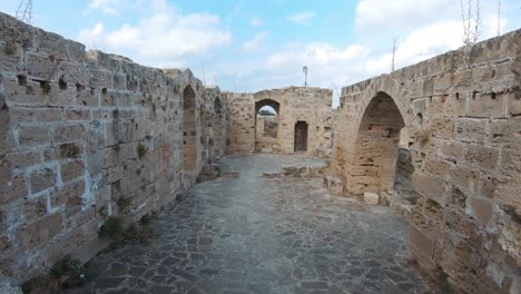 entering romanesque style old top section of kyrenia castle in cyprus - wide push in shot