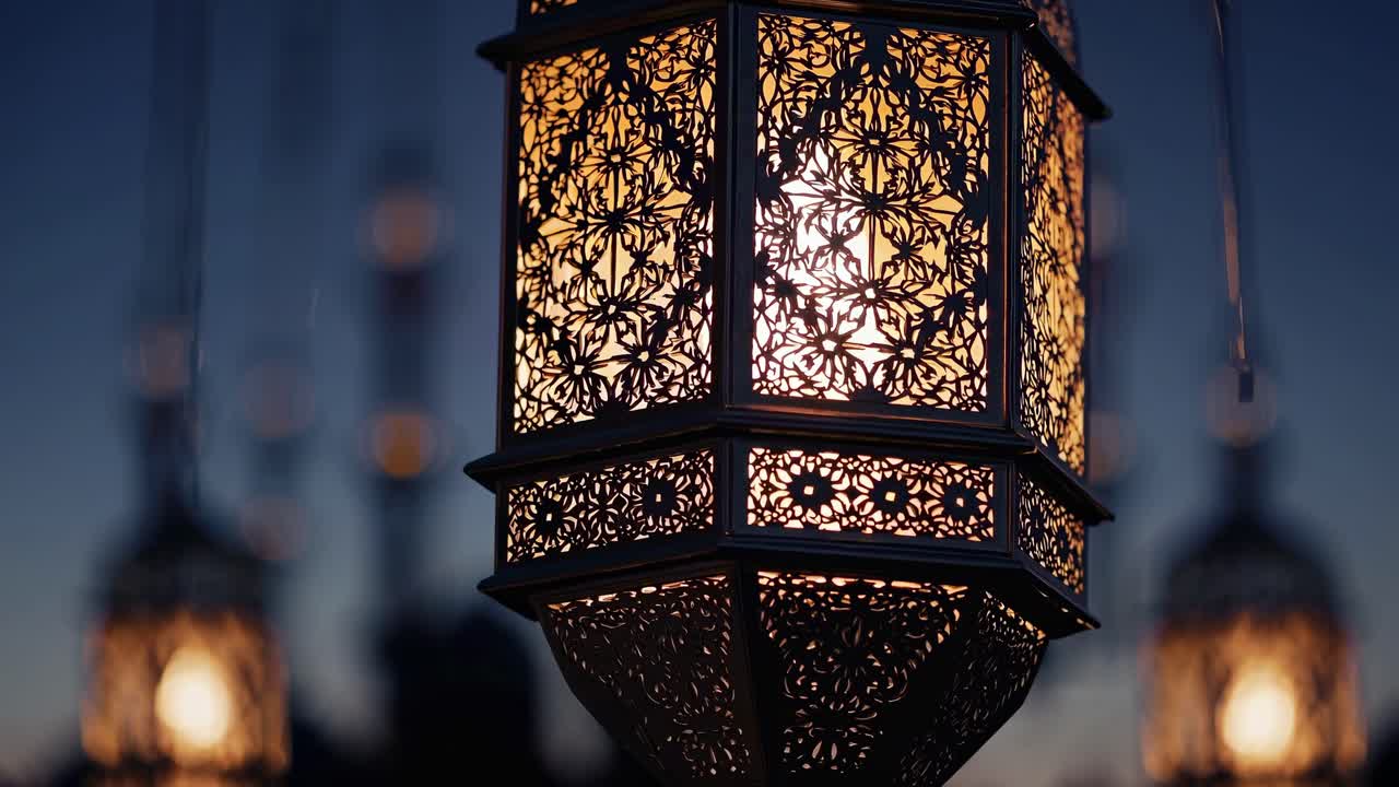 Blurred close-up of ornate lanterns with minarets in the background at dusk, creating a mystical