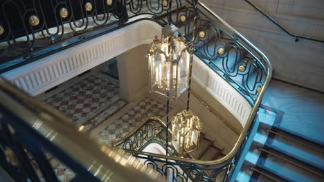 Establish-staircase-at-luxury-hotel-in-Paris,-interior-vintage-gold-decorations