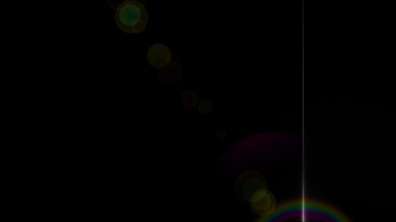 밝은 렌즈 플레어는 검은색 배경에 빛이 누출되는 필름 효과를 나타니다.