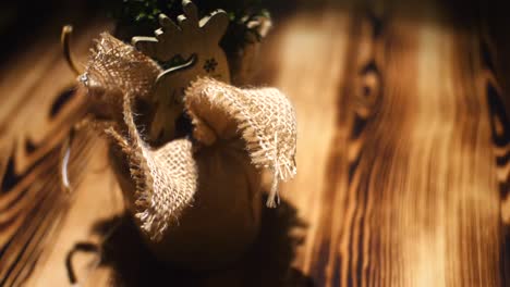 small christmas tree ornament on wooden table