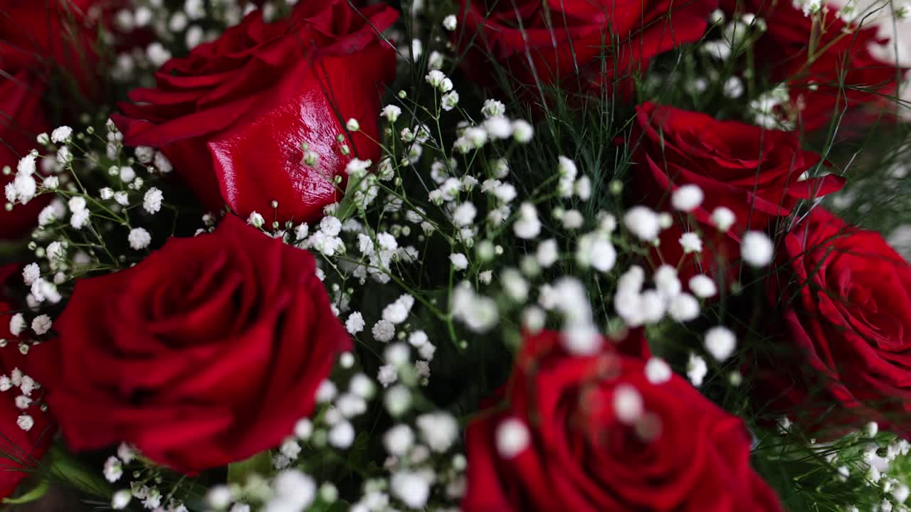 A bouquet of red roses and baby's breath