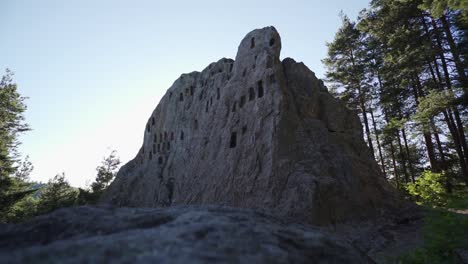 Approaching-drone-shot-of-Eagle's-Rock,-more-commonly-known-as-Orlovi-Skali,-a-religious-sacrificial-altar-in-the-Rhodope-Mountains-in-Bulgaria