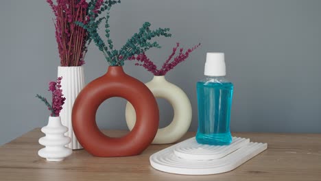 modern mouthwash display with decorated vases