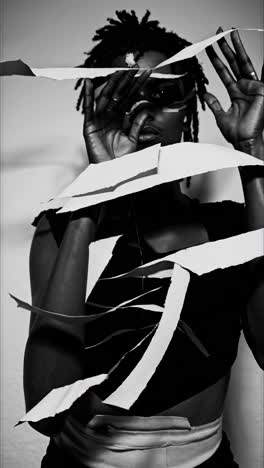 monochrome portrait fragmenting identity, revealing inner turmoil and psychological complexity through distorted facial features and textured dreadlocks