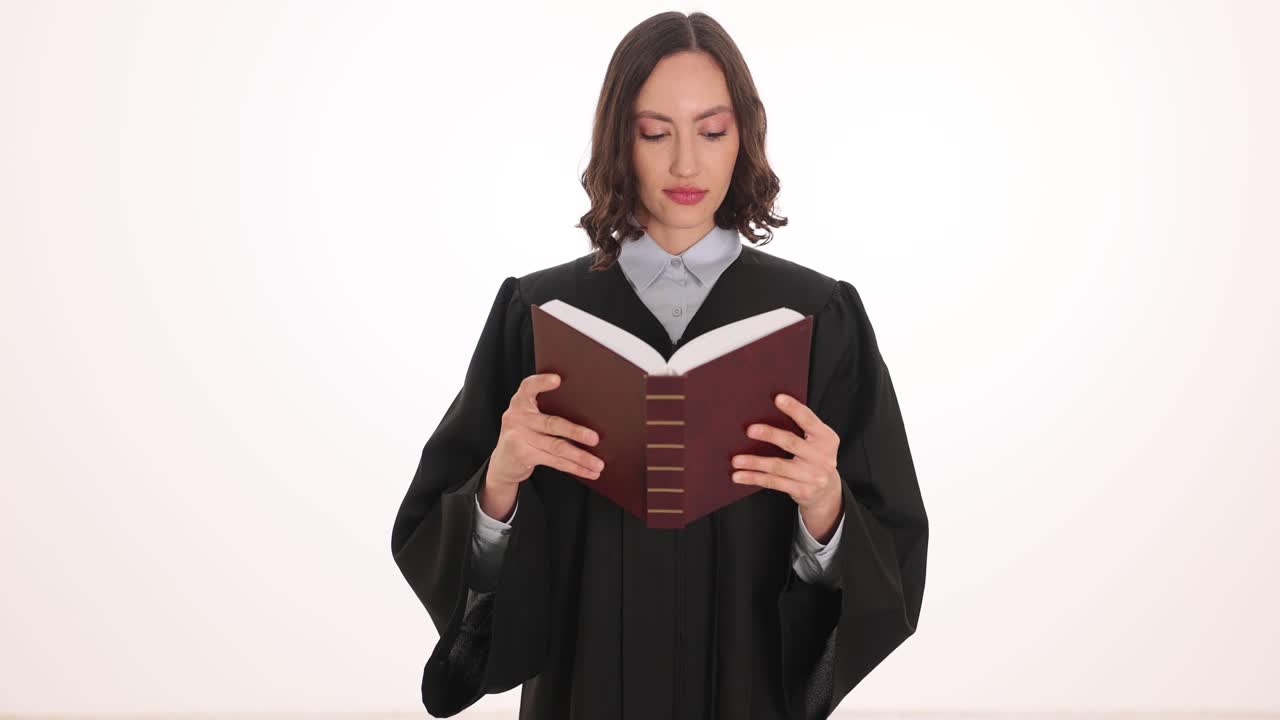 Woman in Judicial Robe Reading a Book