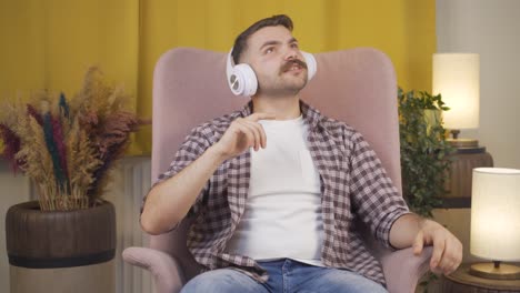 happy man listening to music with headphones.