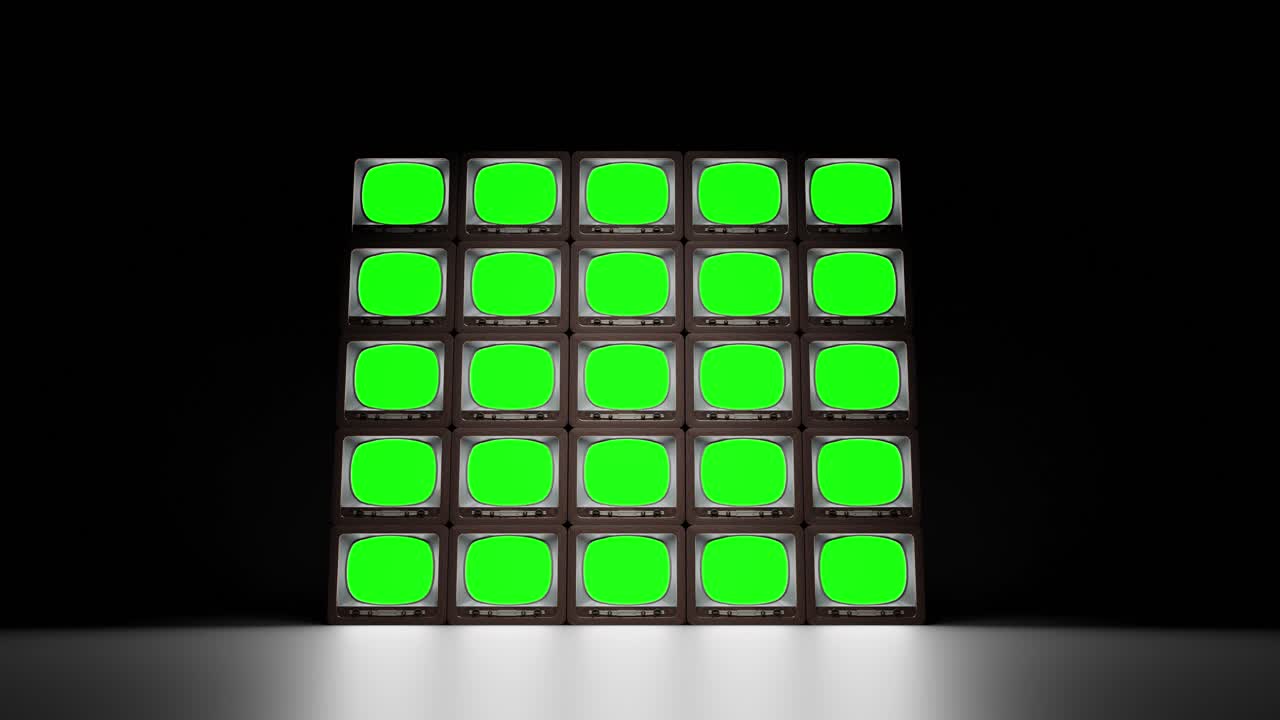 Set of retro TVs with green screen in dark studio