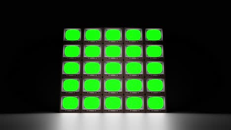 set of retro tvs with green screen in dark studio