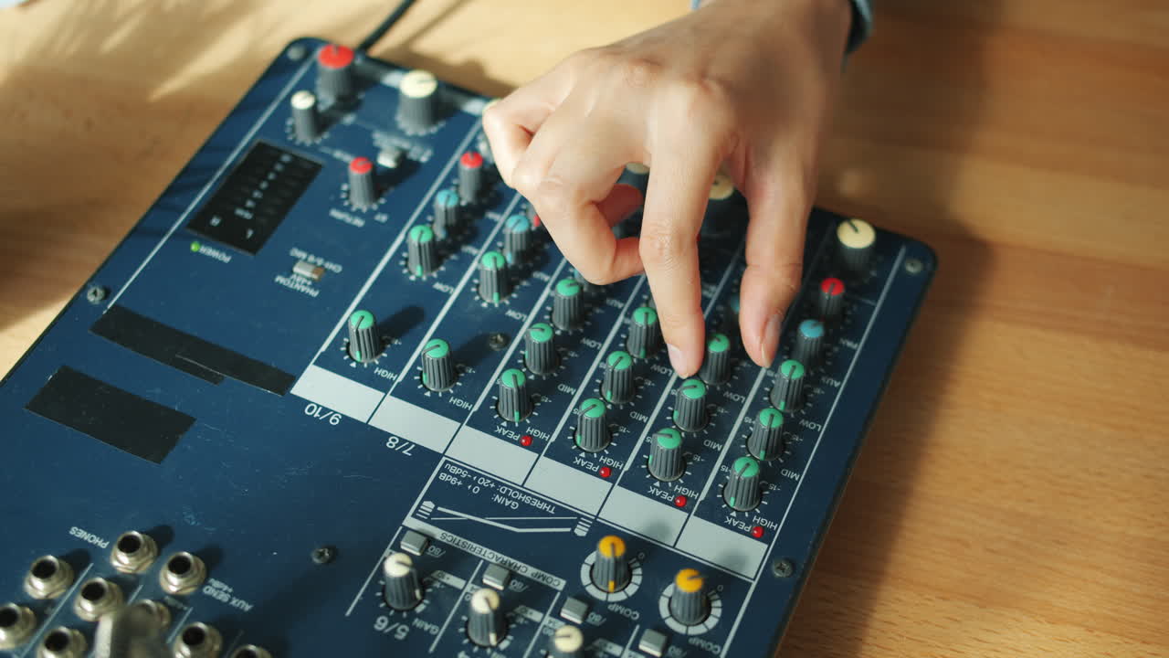 Woman Adjusting Sound Mixer