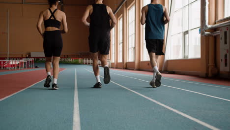 back view of athletes running