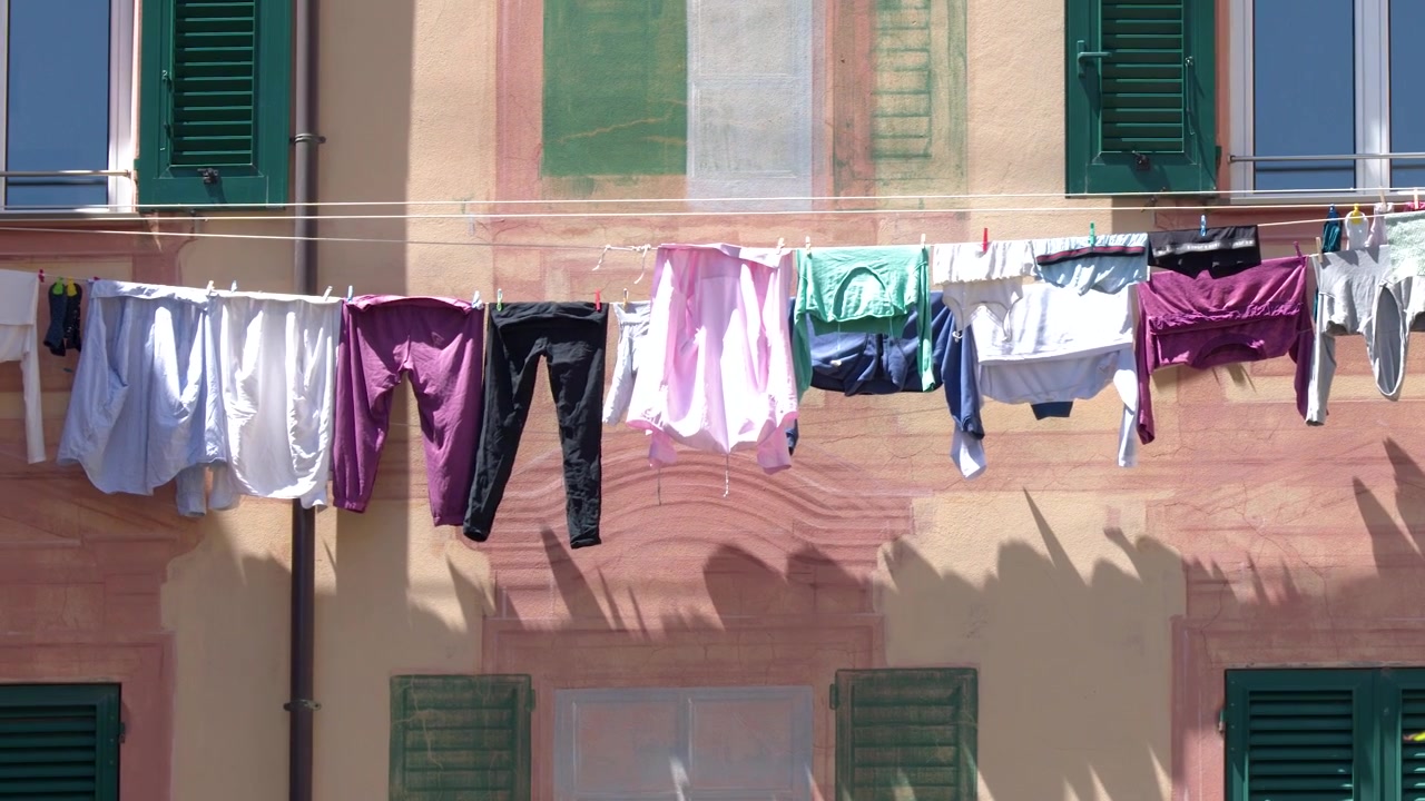 Laundry Hanging on a Clothesline Against a Traditional Italian Building Facade