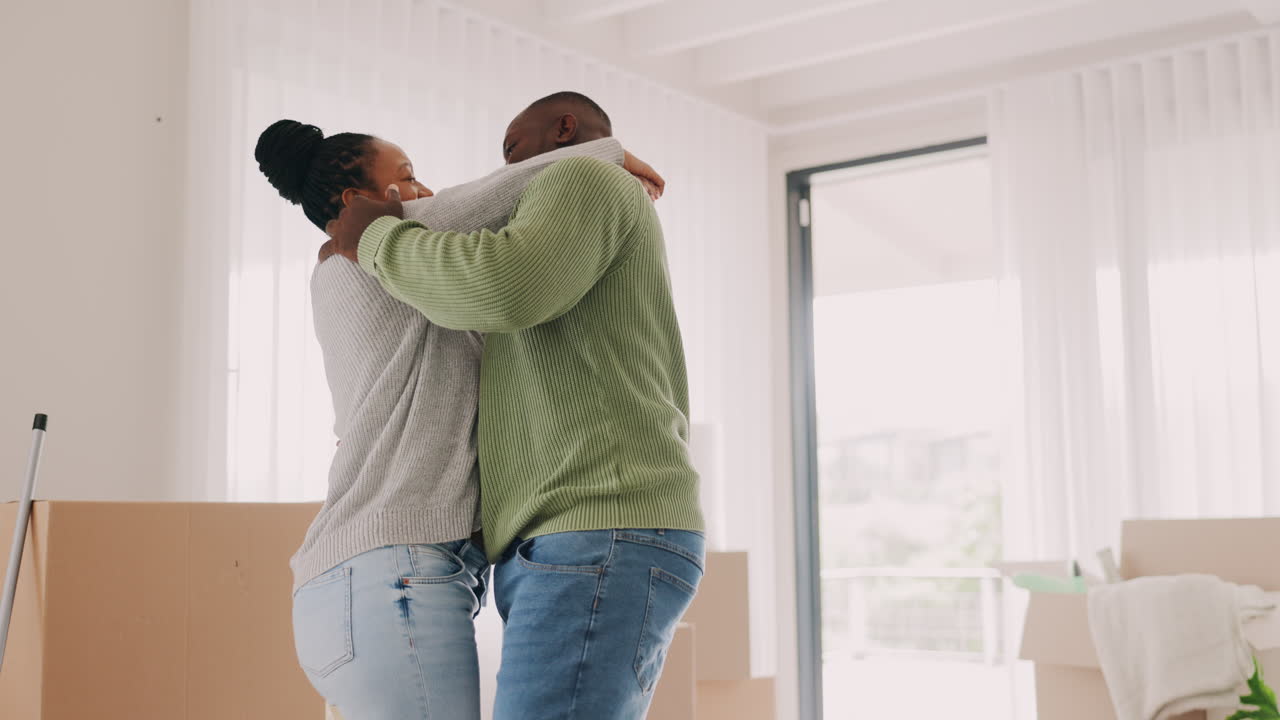 Black couple, moving in and dancing to celebrate