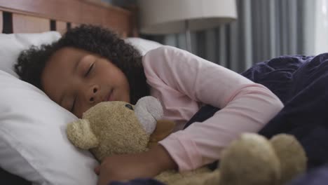 african american girl sleeping in her bed